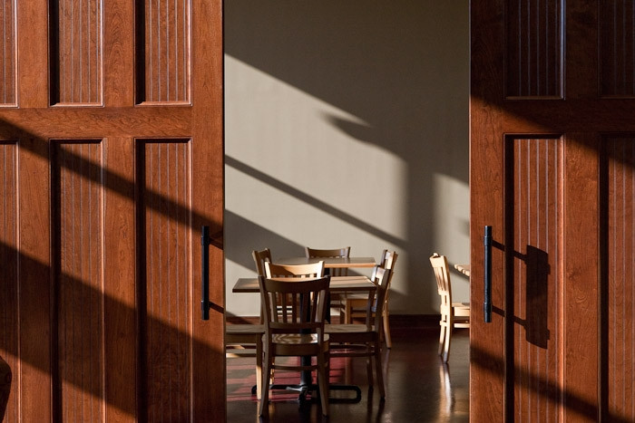 Beautiful cherry interior sliding carriage doors built by Evergreen Carriage Doors