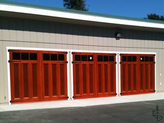3 sets of carriage doors add increased light and functionality to this workshop