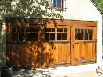 This beautifully unique 3-door set replaces old roll-up doors on what used to be a double car garage.