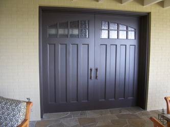 Sliding pocket doors with seedy glass, enclose a BBQ alcove.